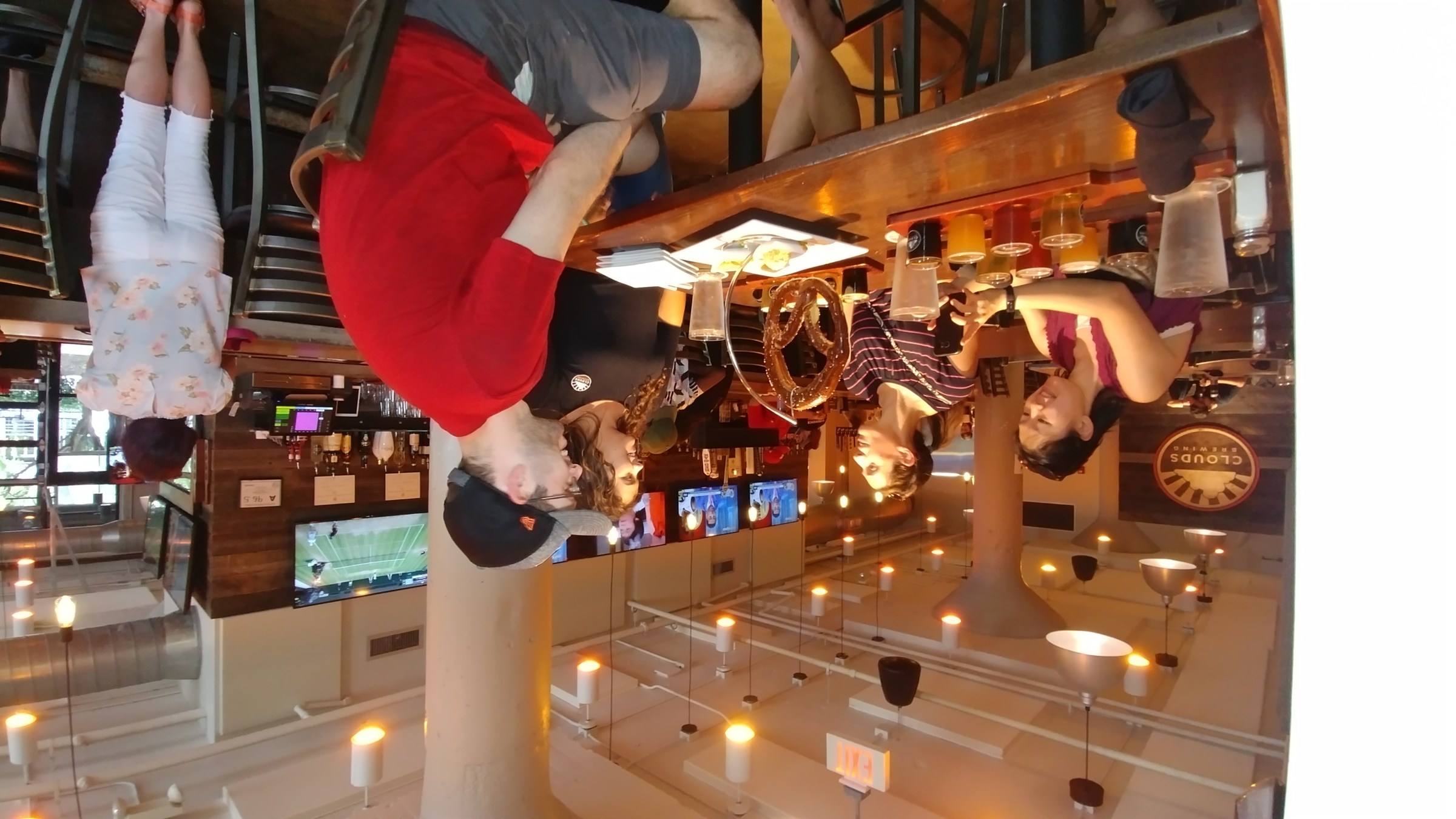 a group of people sitting at a table in a restaurant